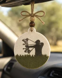 Handmade bow hunter freshie, a country-western scented aroma bead car air freshener shaped with an archery deer-hunting design, hanging from a rearview mirror.