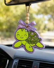 Cute handmade sea turtle car freshie made from scented aroma beads, an ocean-themed novelty air freshener for hanging on a car rearview mirror.