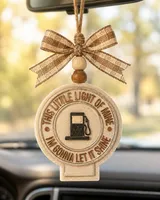 Handmade sun-shaped aroma bead car freshie with "Let It Shine" faith lettering, a boho sunshine air freshener hanging from a car rearview mirror.