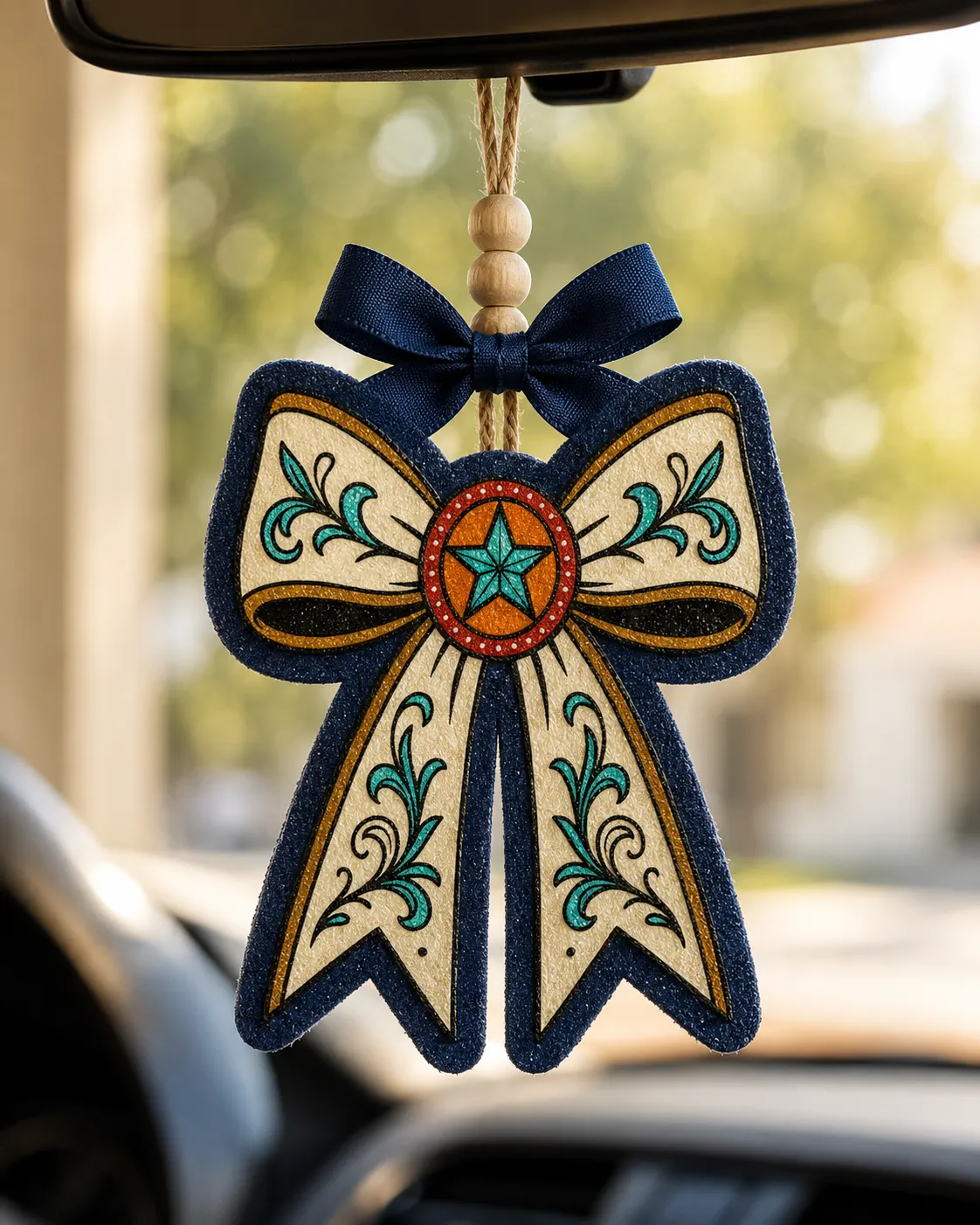 Handmade Texas Lone Star shaped car freshie scented aroma bead air freshener in western country style hanging from a car rearview mirror