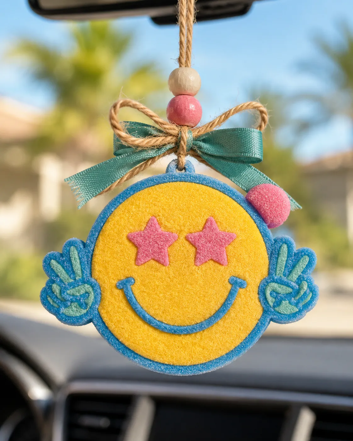 Retro smiley face and peace sign car freshie made from scented aroma beads, a groovy hippie-style hanging air freshener for cars.