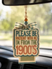 Handmade car freshie air freshener with the funny phrase "Please Be Patient With Me, I'm From the 1900s," a novelty scented aroma bead car accessory hanging from a rearview mirror.